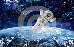 Spaceman flying in space.mission in outer space photo