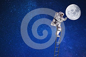 Spaceman on moon in outer space on leader photo