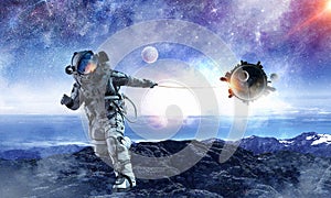 Spaceman steal planet. Mixed media photo