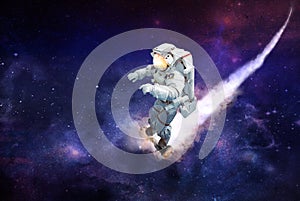 Spaceman traveling on a scooter in outer space photo