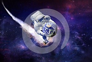 Spaceman traveling on scooter witch planet Earth in hands in galaxy photo