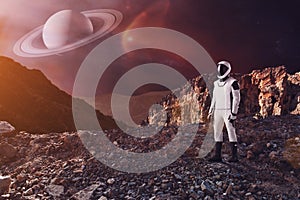 Spaceman walks on the alien planet. Space Mission. Elements of this image furnished by NASA