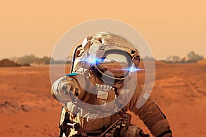 Spaceman walks on the red planet Mars. Space Mission.