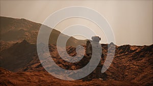 Spaceman walks on the red planet Mars. Space Mission