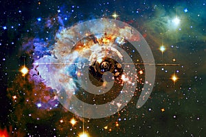 Spaceship in outer space against the background of the nebula.