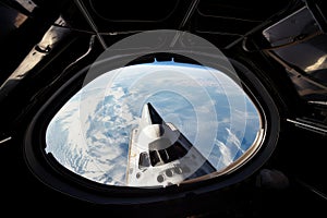 spaceshuttle launch, with view of the earth visible through the window