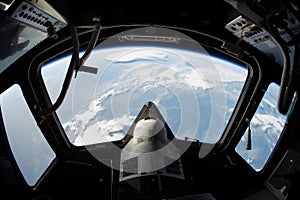 spaceshuttle launch, with view of the earth visible through the window