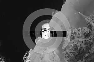 The SpaceX Dragon resupply ship is pictured approaching the Space Station. Elements of this image furnished by NASA