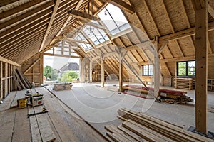 Spacious attic under construction with exposed beams