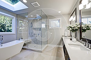 Spacious bathroom in gray tones with heated floors