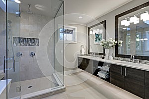 Spacious bathroom in gray tones with heated floors photo