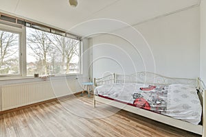 Spacious bright bedroom with a wardrobe with mirror