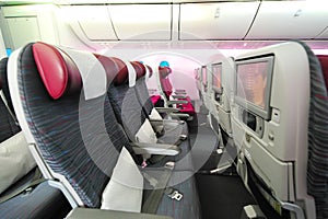 Spacious and comfortable economy class cabin of Qatar Airways Boeing 787-8 Dreamliner at Singapore Airshow