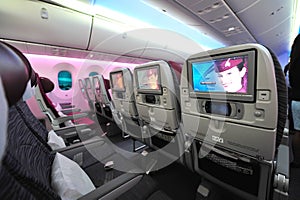 Spacious and comfortable economy class cabin of Qatar Airways Boeing 787-8 Dreamliner at Singapore Airshow