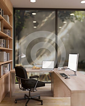 A spacious contemporary office features a laptop and a PC computer on a wooden L shape table