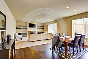 Spacious dining area with table set connected to living room