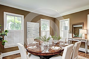 Spacious dining room interior with tasteful furniture photo