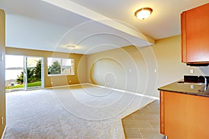 Spacious family room with kitchen cabinets.