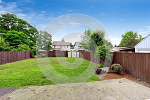 Spacious fenced backyard with shed