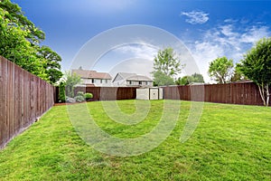 Spacious fenced backyard with shed