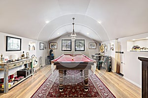 Spacious game room with a pool table