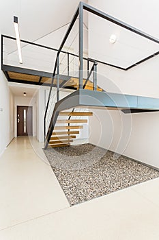 Spacious interior with mezzanine stairs