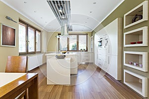 Spacious kitchen with white furniture