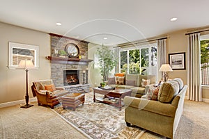 Spacious living room with fireplace, carpet floor and rug