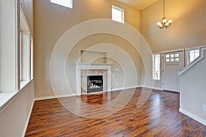 Spacious living room, fireplace and new hardwood floor photo