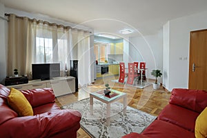 Spacious living room with kitchen area