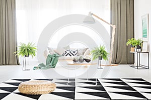 Spacious living room with pouf