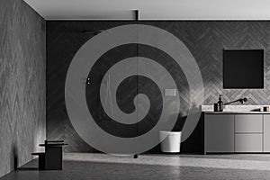 Spacious modern bathroom design interior in grey tones with concrete floor, walk-in shower, sink vanity. Window light