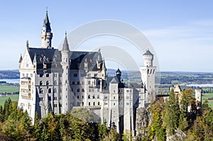 A spacious panoramic view of a romantic ancient castle named Neuschwanstein located in Bavaria Germany