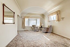 Spacious sitting room in creamy colors.