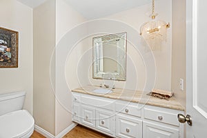 Spacious white bathroom with oversized mirror above sink in Encino, CA