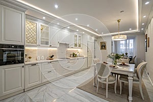 Spacious white kitchen after renovation