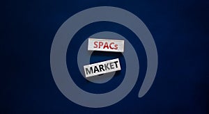 SPACs market symbol. Wooden blocks with words `SPACs, special purpose acquisition companies market` on beautiful black backgroun