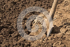 Spade or shovel in soil