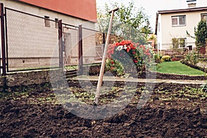 Spade stuck in the dirt as a symbol of victory over a difficult task. Satisfaction after hard work. Work in the countryside.