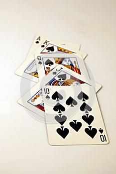 Spades royal flush poker hand in black