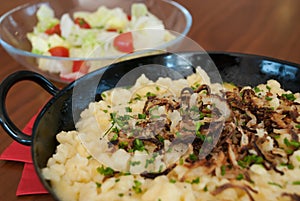 Spaetzle with melted cheese in pan - kÃÂ¤sespÃÂ¤tzle kasnocken photo
