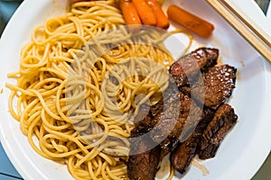 Spagetti Pasta with meat carrots white plate