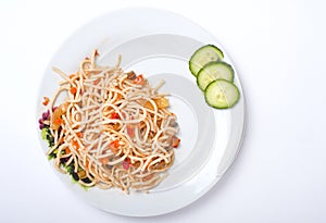 Spagetti with vegetables on the white plate
