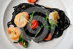 Spaghetti al Nero di Seppia with Squid Ink and Prawns photo