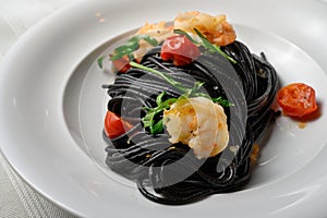 Spaghetti al Nero di Seppia with Squid Ink and Prawns photo