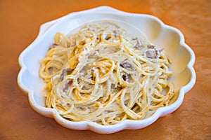 Spaghetti alla carbonara on plate in Sicily