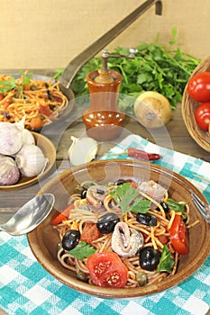 Spaghetti alla puttanesca with olives and capers