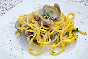 Italian food. Spaghetti alle vongole, pasta with clams photo