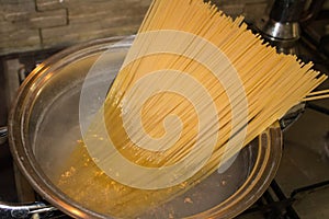 Spaghetti being cooked in a pot