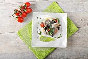 Spaghetti with black sepia, parsley and cherry tomatoes